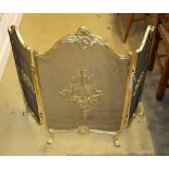 A Louis XV style gilt metal framed triple spark guard, W.110cm, H.80cm