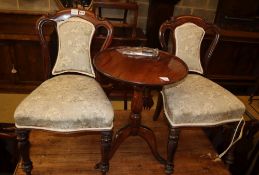 A 19th century mahogany tripod wine table, 50cm diameter and a pair of Victorian mahogany dining