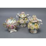 A pair of Minton or Coalport two handled floral encrusted pot pourri vases and covers and a floral
