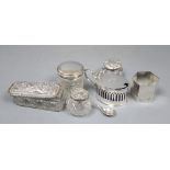 An Edwardian silver mustard pot, a silver napkin ring and four silver mounted cut glass toilet