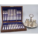 A Victorian electroplate egg cruet stand and cased set of fruit knives and forks