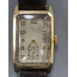 A gentleman's 1930's 9ct gold rectangular dial wrist watch, with Arabic dial and subsidiary seconds,