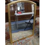 A gilt arched overmantel mirror, W.90cm, H.130cm