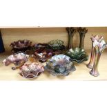 A quantity of mixed green and orange Carnival glass dishes and vases