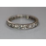 A white metal and diamond set full eternity ring, size O, gross 2.8 grams.CONDITION: Decoration on