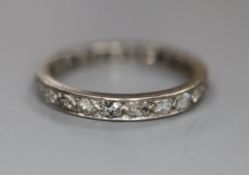 A white metal and diamond set full eternity ring, size O, gross 2.8 grams.CONDITION: Decoration on