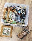 A collection of mixed ceramics tiles and a murano glass paper weight