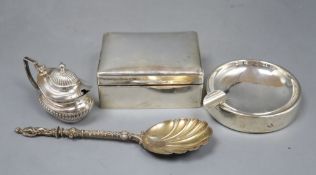 A silver cigarette box, a silver mounted ashtray, a silver spoon and a plated mustard.