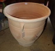 A large circular terracotta garden planter, 58cm diameter, H.56cm