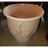 A large circular terracotta garden planter, 58cm diameter, H.56cm