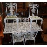 A white painted cast aluminium garden table, W.142cm, D.74cm, H.70cm and six chairs