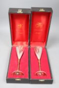 Two cased Stuart Devlin parcel gilt silver champagne flutes, London, 1980, numbered 546 & 191, 22.