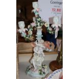 A Sitzendorf floral encrusted figural candelabra, blue factory mark, height 45cm