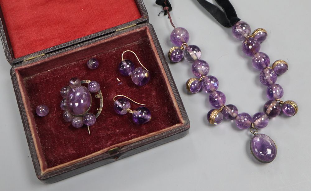 A Victorian amethyst bead and black sash necklace, (quartz section 21cm) and a similar brooch and