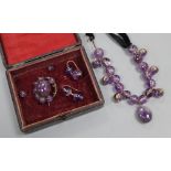 A Victorian amethyst bead and black sash necklace, (quartz section 21cm) and a similar brooch and