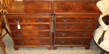 A pair of Georgian style banded walnut chests, each fitted brushing slide over four graduated long