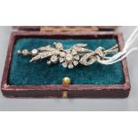 A Victorian yellow and white metal, diamond set floral spray brooch, 58mm, gross 7.5 grams.