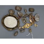Fourteen items of Victorian yellow or gilt metal mounted mourning jewellery including twelve