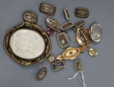 Fourteen items of Victorian yellow or gilt metal mounted mourning jewellery including twelve