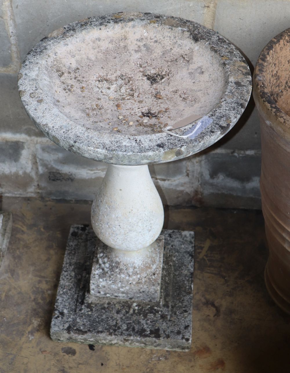 A reconstituted stone bird bath, diameter 44cm, H.68cm