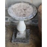 A reconstituted stone bird bath, diameter 44cm, H.68cm