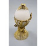 An opaque glass gilt metal egg-shaped necessaire