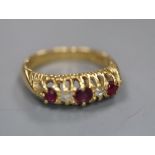 A late Victorian 18ct gold, ruby and diamond five stone ring, size I, gross 3.6 grams.