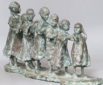 Lucy Poelt. A bronze of 'Seven South children in a line', signed, height 29cm width 58cm