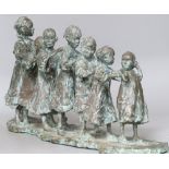 Lucy Poelt. A bronze of 'Seven South children in a line', signed, height 29cm width 58cm
