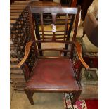 A George III Provincial elm elbow chair