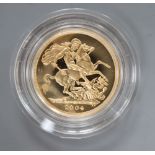 A 2004 gold proof sovereign.
