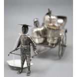 An early 20th century Chinese Export white metal cruet stand, modelled as a rickshaw, maker KC,