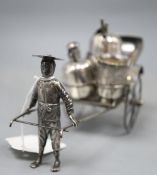 An early 20th century Chinese Export white metal cruet stand, modelled as a rickshaw, maker KC,