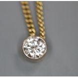 An 18ct gold and solitaire diamond pendant necklace, gross 5.8 grams.