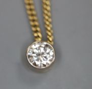 An 18ct gold and solitaire diamond pendant necklace, gross 5.8 grams.