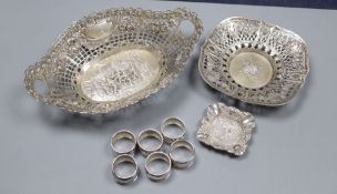 Three assorted white metal dishes, two German stamped 800 and a set of six small 835 napkin rings?