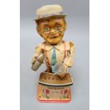 A Charlie Weaver bartender tin battery operated toy