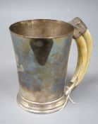 A George VI silver mug with boar's tusk handle, Goldsmiths & Silversmiths Co Ltd, Birmingham,