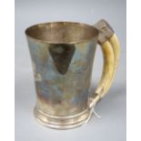 A George VI silver mug with boar's tusk handle, Goldsmiths & Silversmiths Co Ltd, Birmingham,