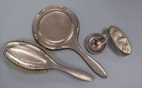 A 22ct gold ring, (lacking stone), 3.6 grams, a silver handled toilet mirror and brush, a silver