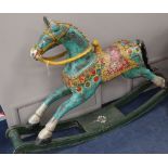 An Indian painted carved hardwood rocking horse, L.160cm, H.104cm