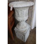 A reconstituted stone campana garden urn on stand, Diameter 40cm, H.88cm