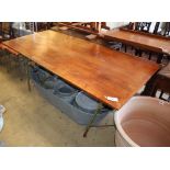 A vintage stained oak and wrought iron trestle table, W.177cm, D.86cm, H.72cm