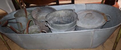 A tin bath, buckets, watering can etc