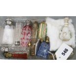 A small collection of assorted scent bottles including silver-mounted and an agate-handled gilt