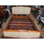 A Louis XV style carved walnut double caned bed frame by Andsotobed, W.160cm, H.120cm