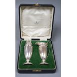 A cased George V silver cream jug and sugar caster by Mappin & Webb, Birmingham, 1925, 6 oz.