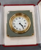 A Cartier travelling clock with box and papers