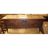 A late 17th century and later oak six plank coffer, on shaped end supports, W.112cm, D.36cm, H.50cm