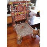 A painted carved Indian low seat chair, W.48cm, D.48cm, H.76cm